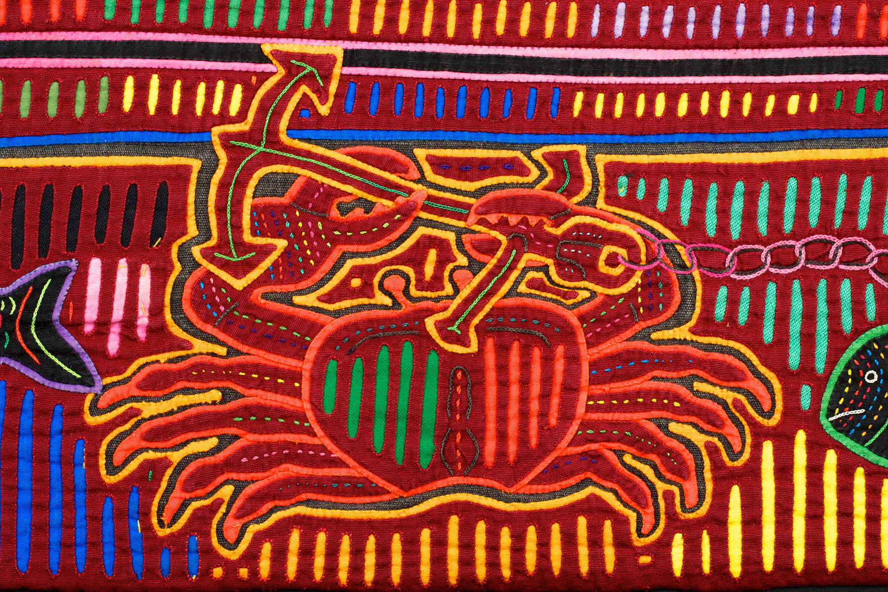 Detail of mola with ship and large crab
